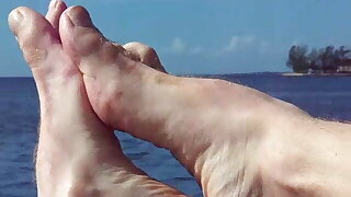 hairyartist feet flexing over water and land