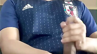 Cum shot Asian guy playing with his big cock in japanese football suit